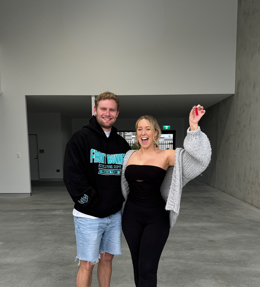 Tarah and Barry holding the keys to the first Voomie warehouse