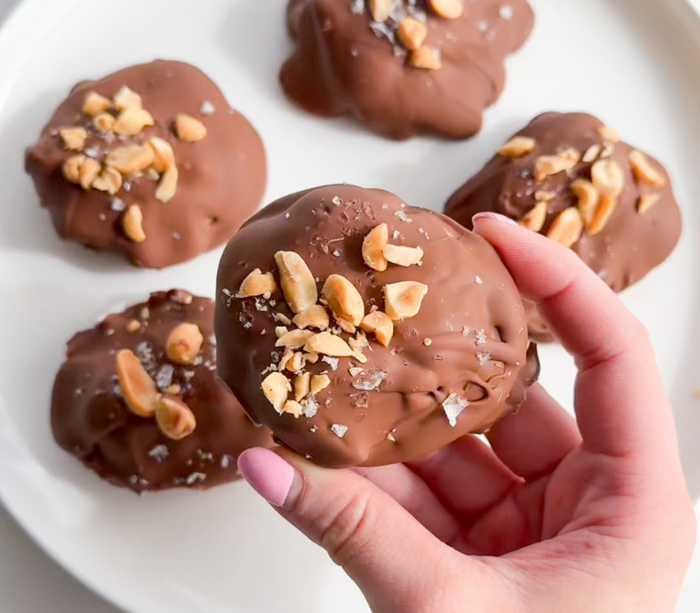 Snickers-Style Frozen Yoghurt Bites topped with crushed peanuts and sea salt, made with Bedtime Bliss for a delicious dessert that helps you wind down.